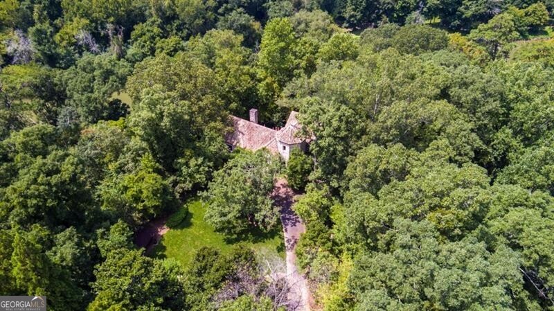 2100 West Wesley Road Northwest Atlanta, GA 30327 - Photo 31 of 42 view of a forest with a houses