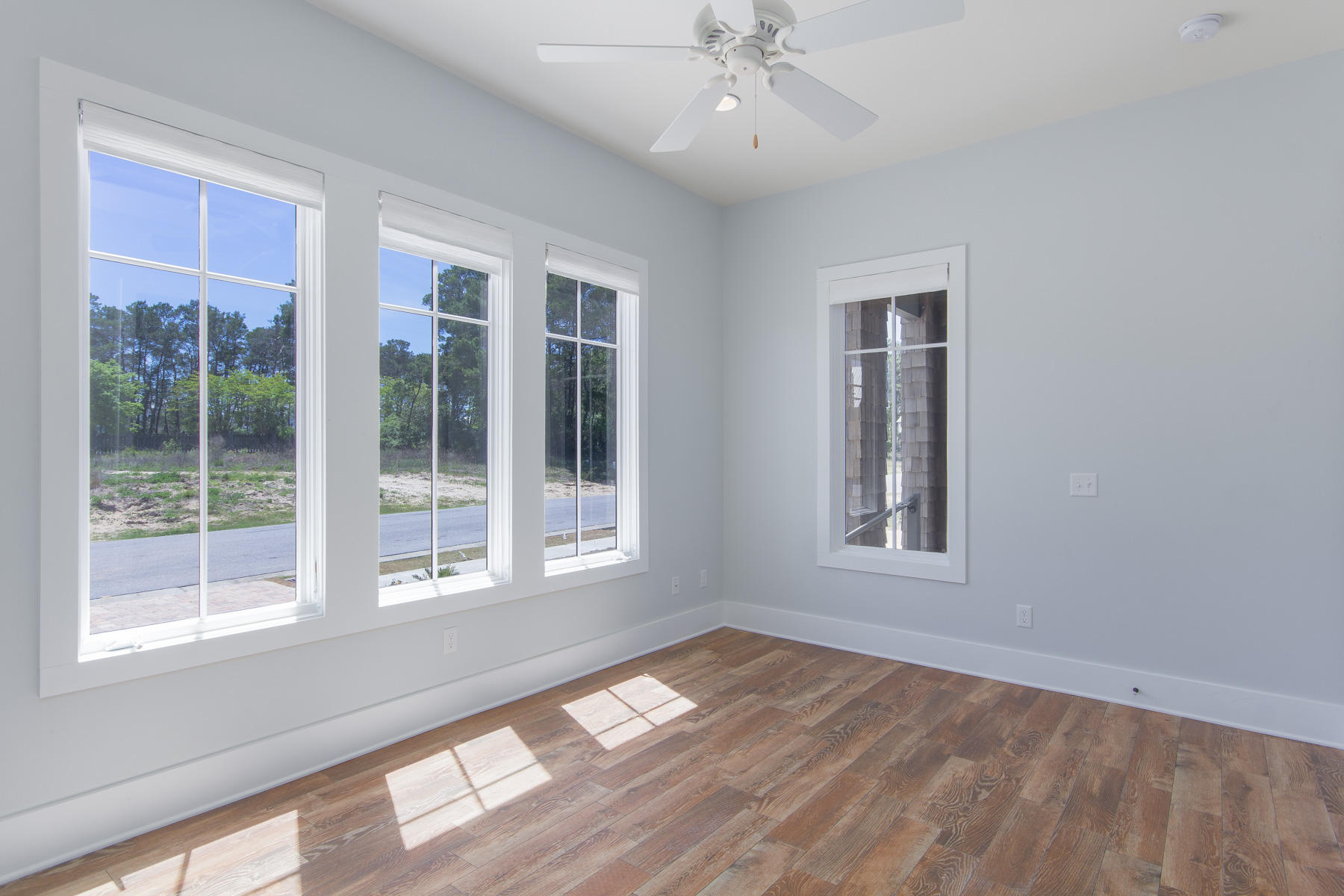 62 West Willow Mist Rd Inlet Beach Inlet Beach, FL 32461 - Photo 11 of 30 a view of an empty room with a window and wooden floor