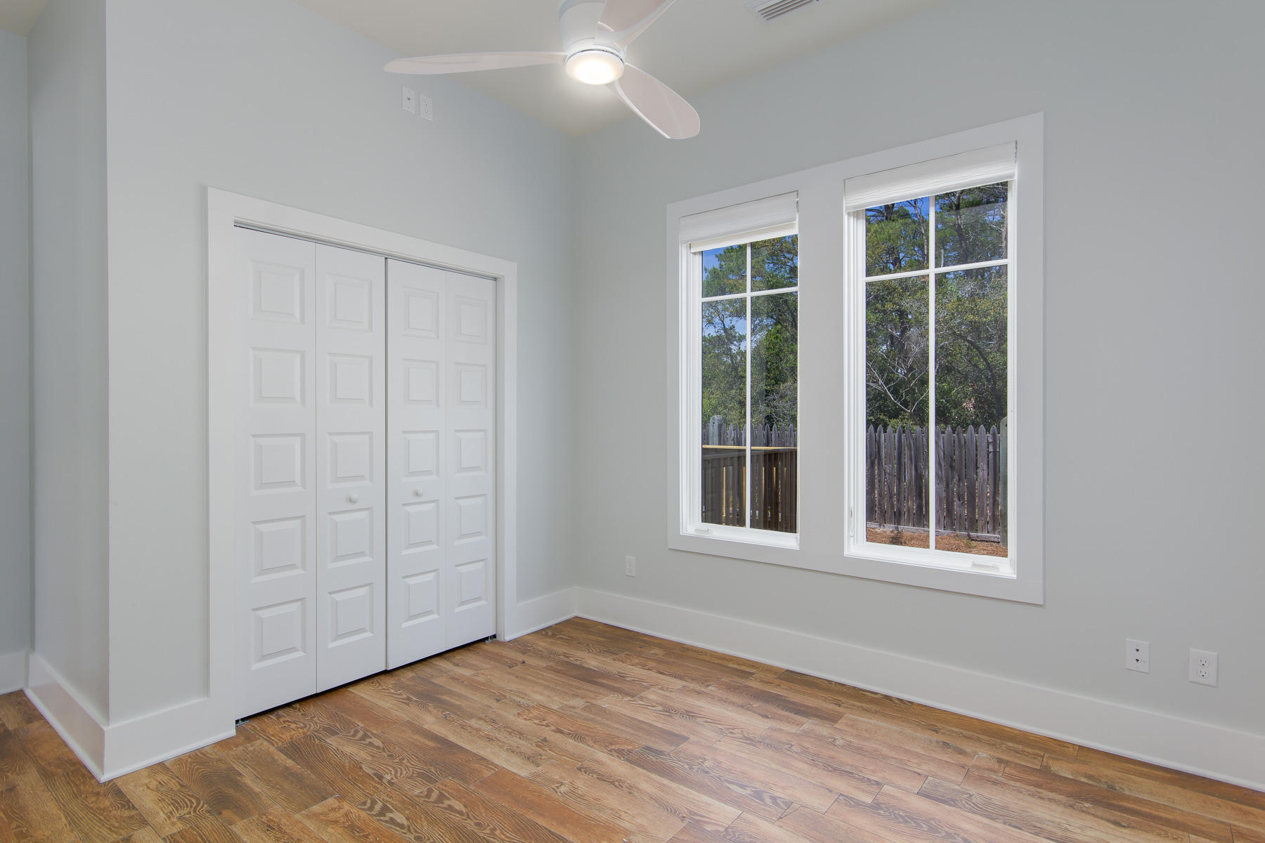 62 West Willow Mist Rd Inlet Beach Inlet Beach, FL 32461 - Photo 13 of 30 a view of an empty room with wooden floor and windows