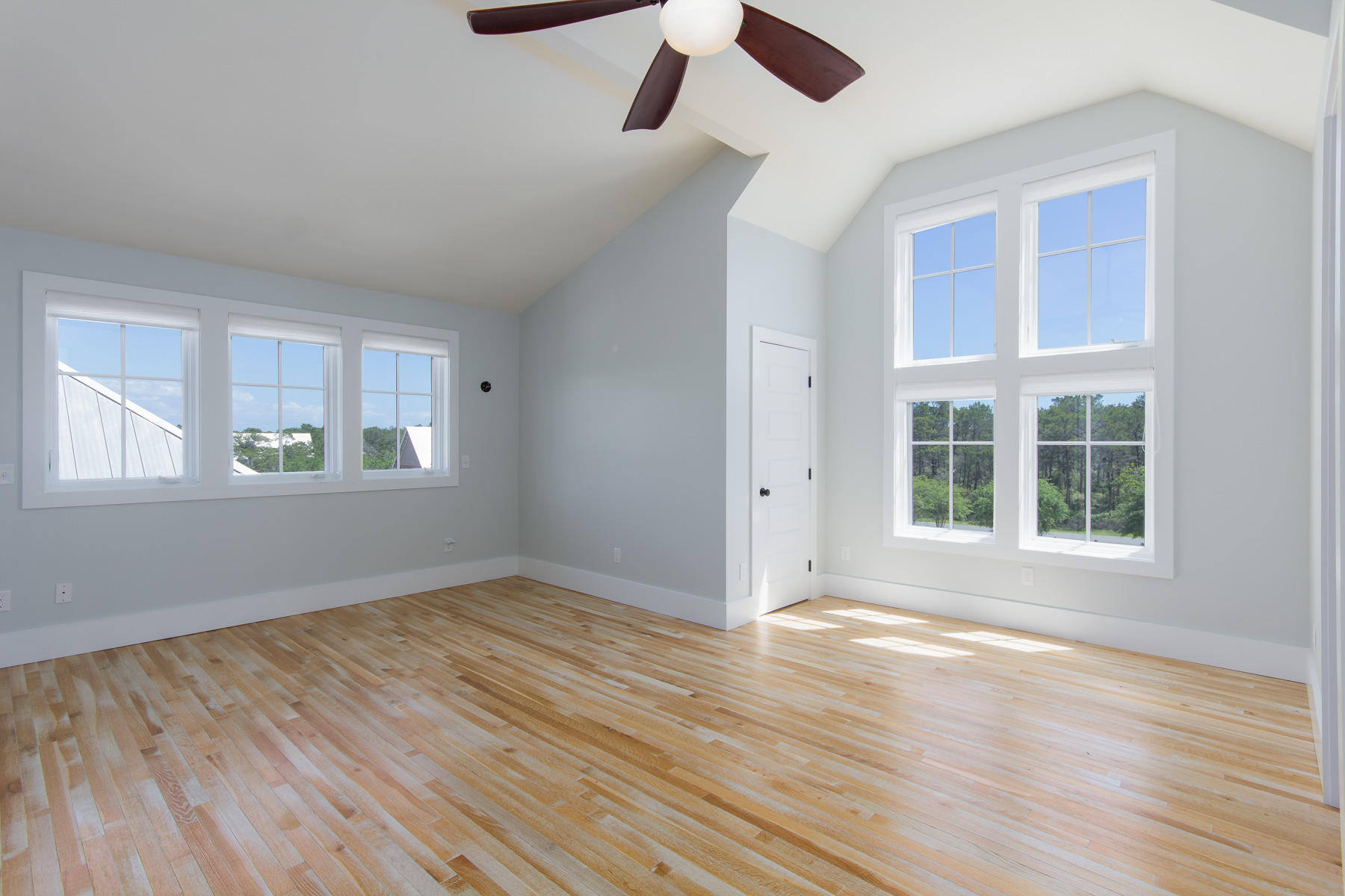 62 West Willow Mist Rd Inlet Beach Inlet Beach, FL 32461 - Photo 22 of 30 an empty room with wooden floor and windows