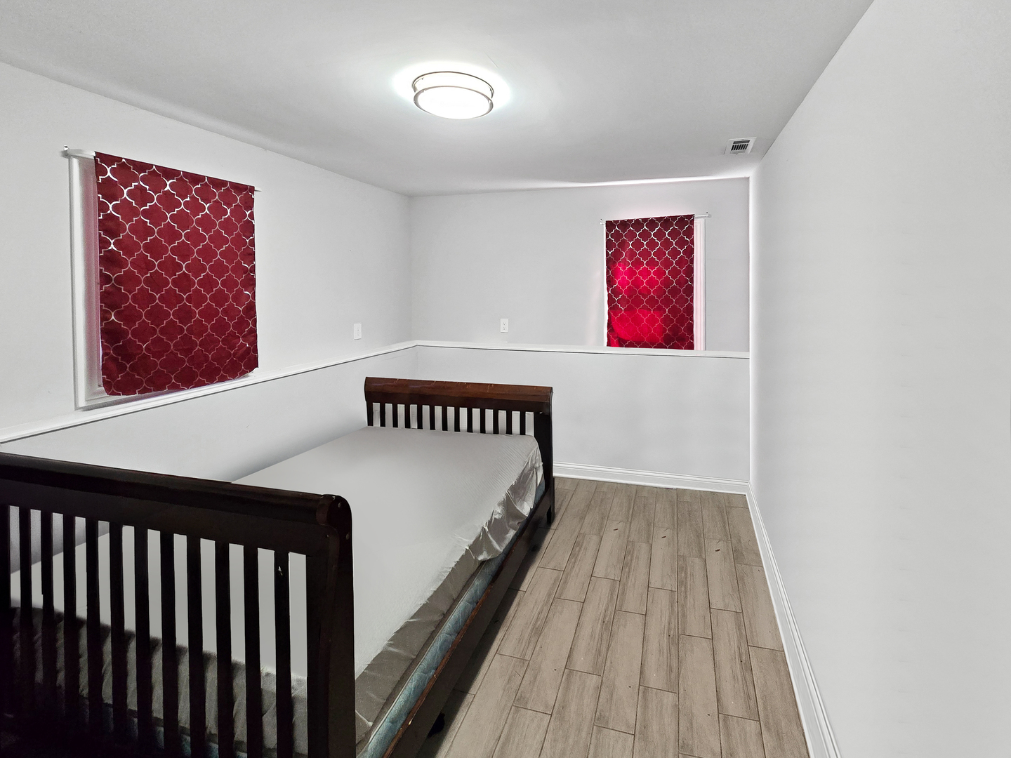 934 Vilmin Road Plano, IL 60545 - Photo 15 of 24 a view of an empty room with wooden floor