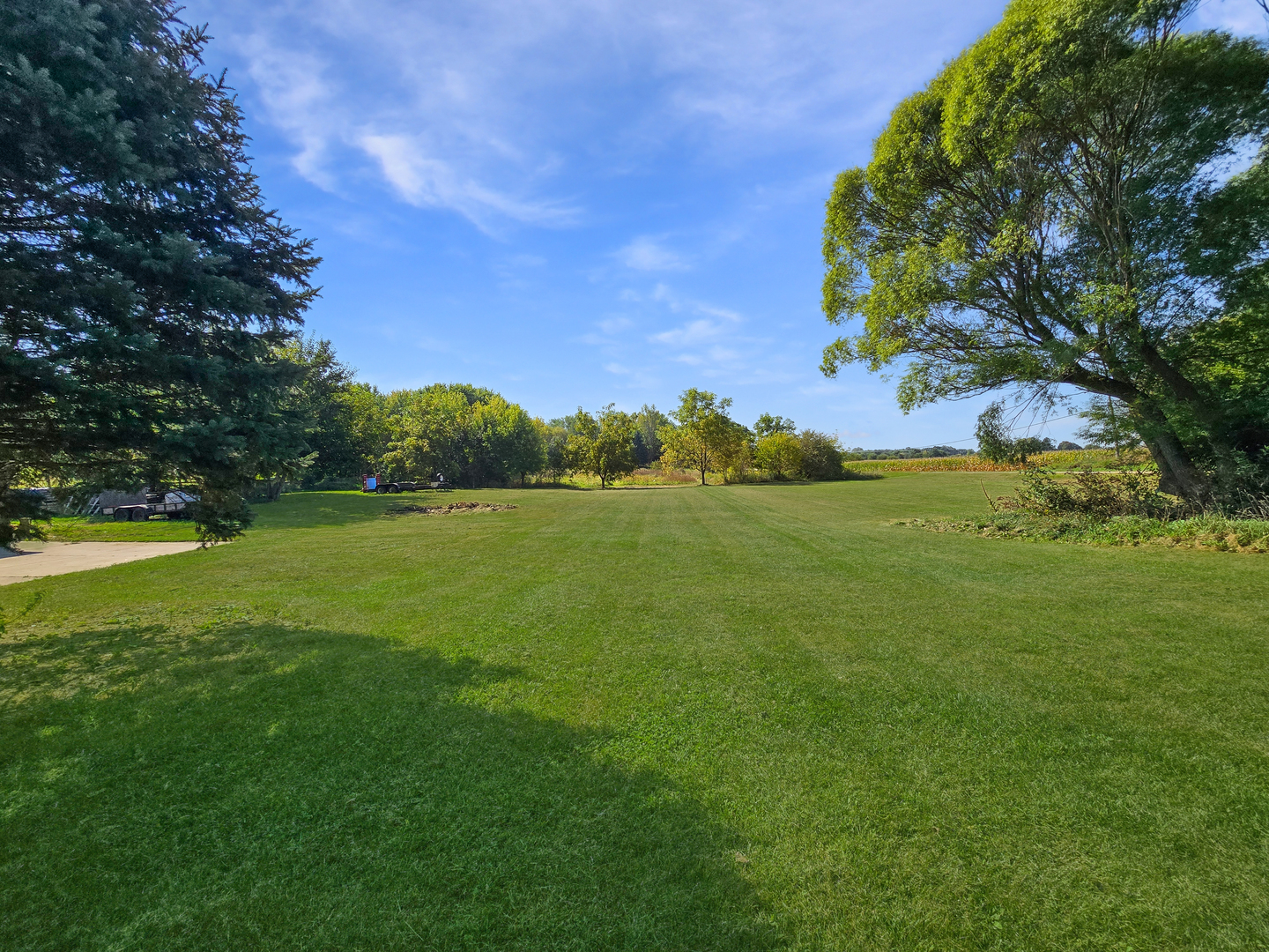 934 Vilmin Road Plano, IL 60545 - Photo 19 of 24 a view of a grassy field with an trees