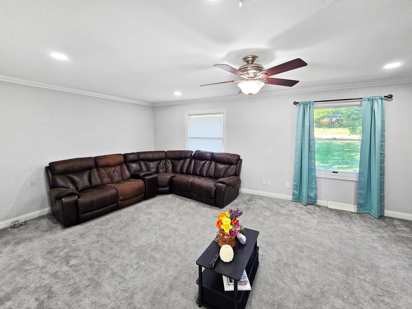 934 Vilmin Road Plano, IL 60545 - Photo 2 of 24 a living room with furniture and a chandelier