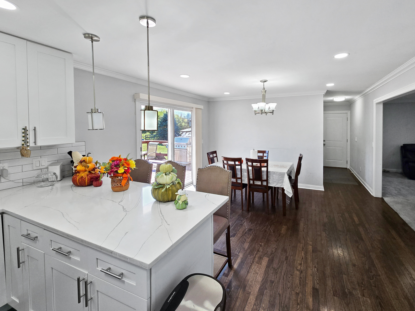 934 Vilmin Road Plano, IL 60545 - Photo 5 of 24 a view of dining table chairs and chandelier