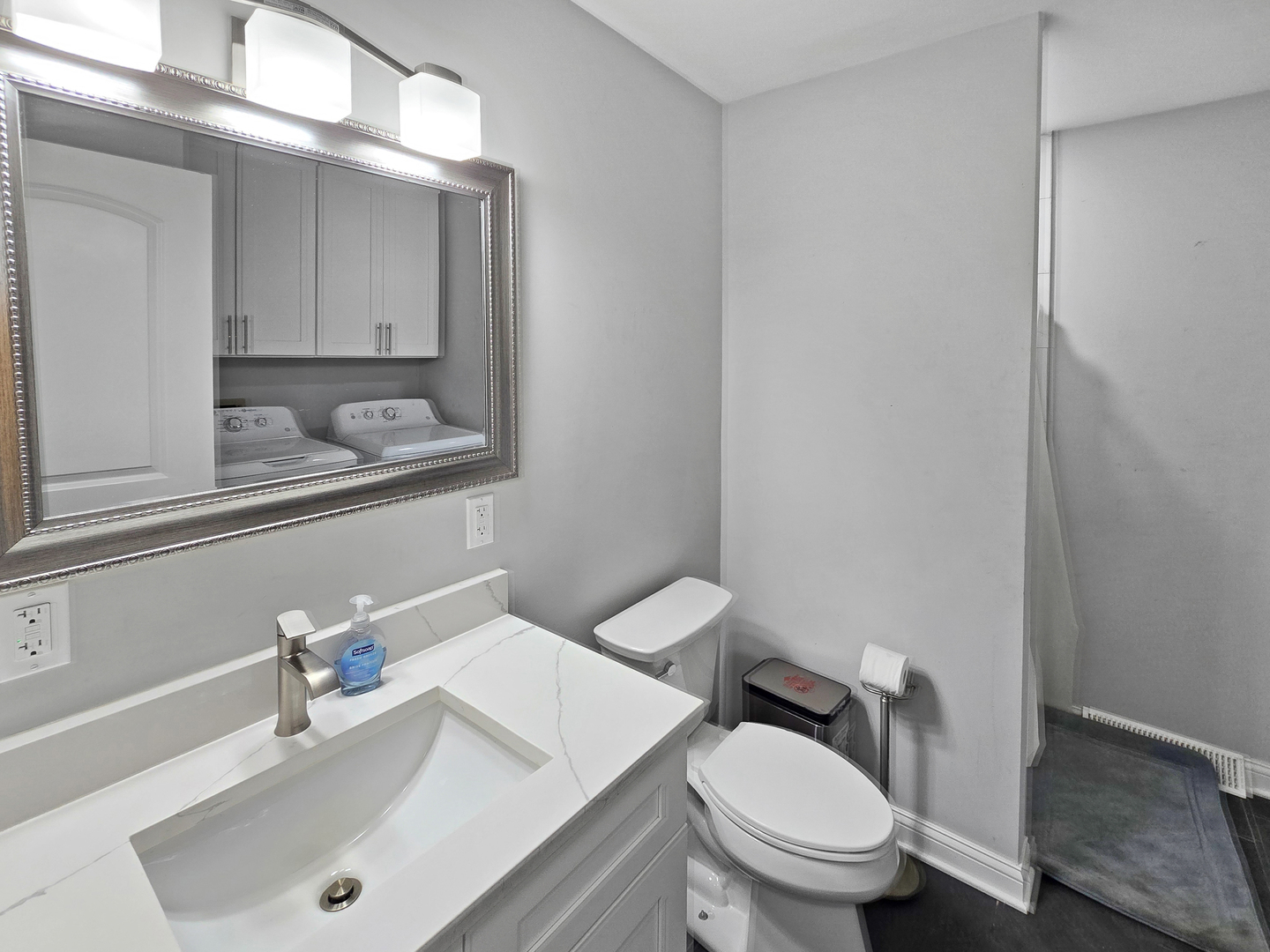 934 Vilmin Road Plano, IL 60545 - Photo 7 of 24 a bathroom with a sink a toilet and mirror