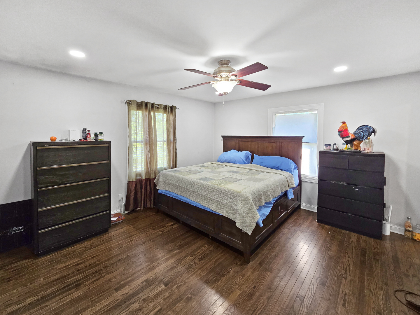 934 Vilmin Road Plano, IL 60545 - Photo 8 of 24 a bedroom with a bed and wooden floor