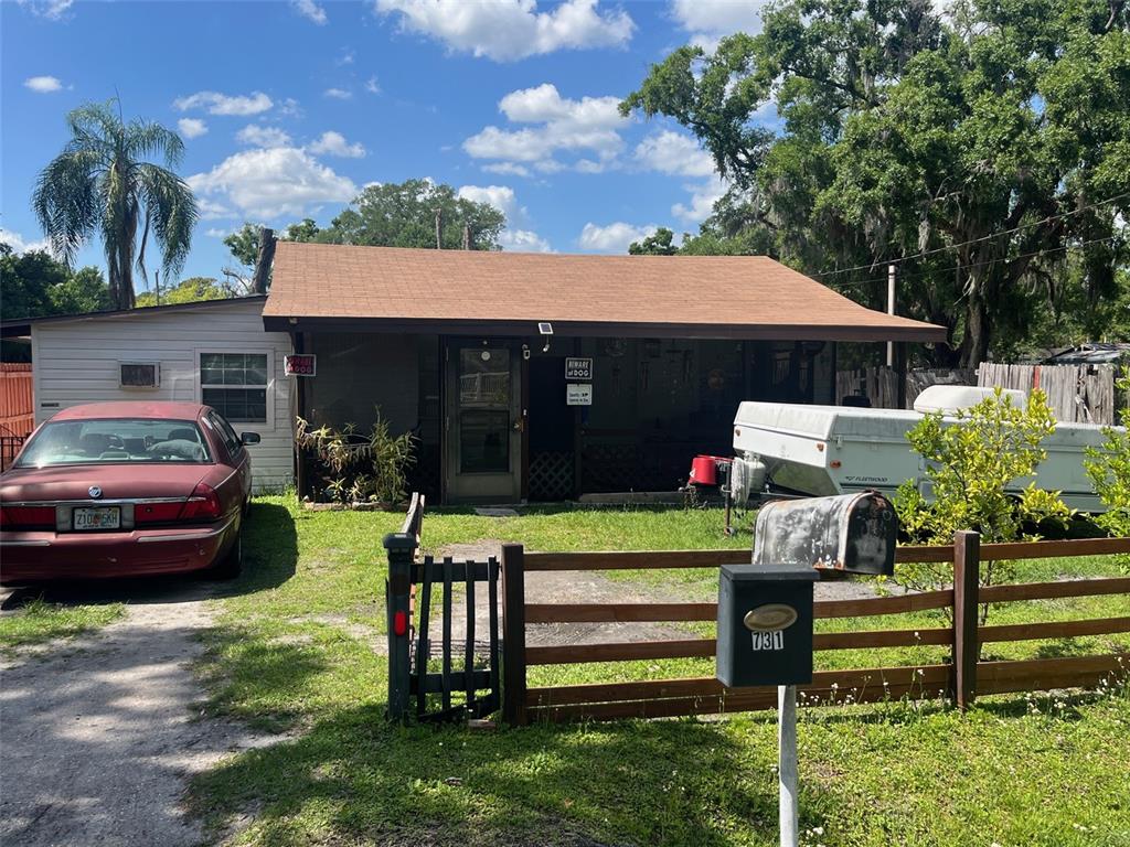 a front view of a house with a yard table and chairs