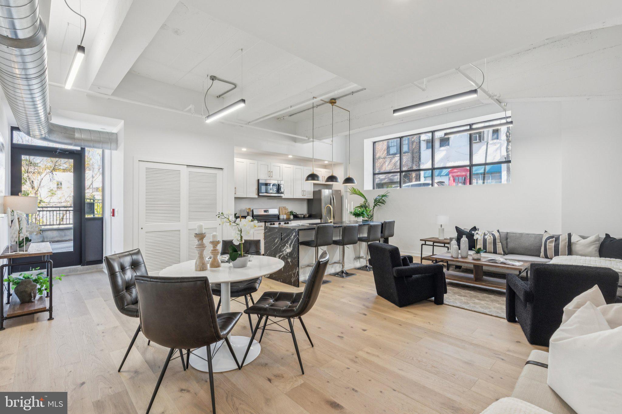 36 North Narberth Avenue, Unit 1C Narberth, PA 19072 - Photo 16 of 36 a living room with furniture a rug and a table