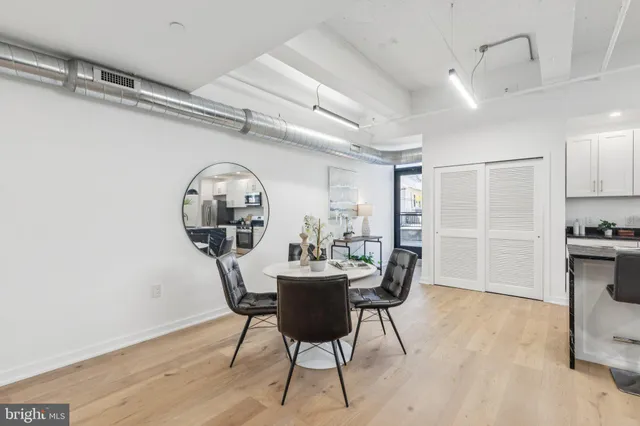 a view of a dining room with furniture and wooden floor