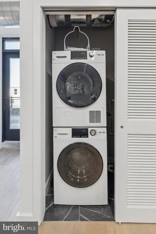 a utility room with dryer and washer