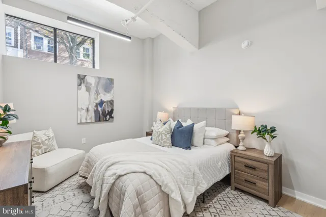 a bedroom with a bed and a couch