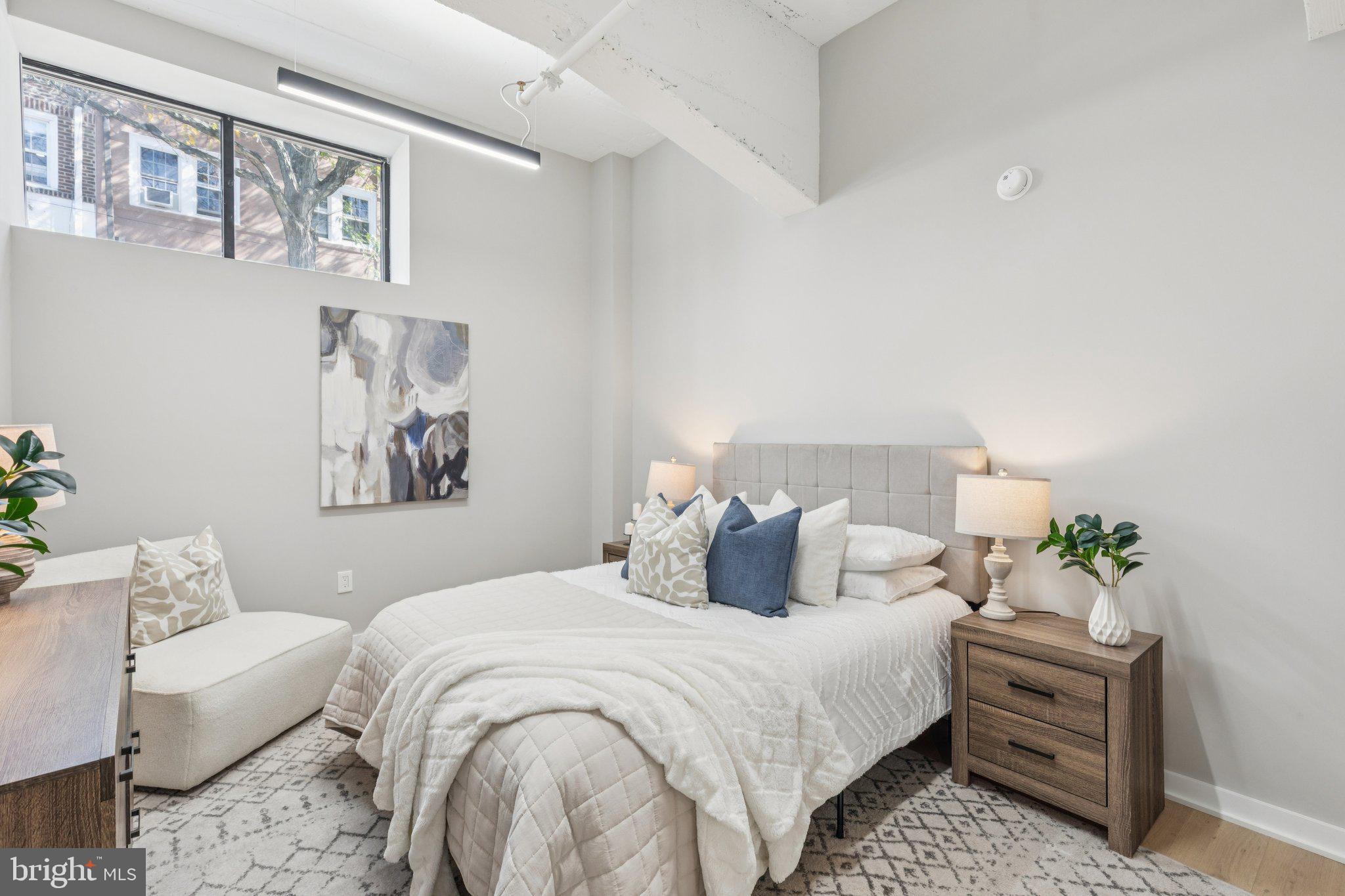 36 North Narberth Avenue, Unit 1C Narberth, PA 19072 - Photo 7 of 36 a bedroom with a bed and a couch