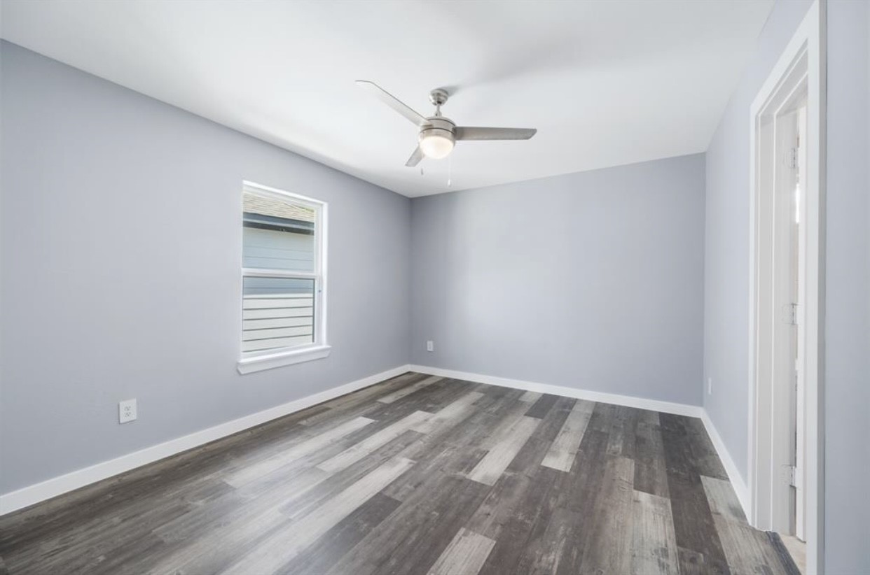 622 Maple Way Houston, TX 77015 - Photo 14 of 19 wooden floor in an empty room with a window