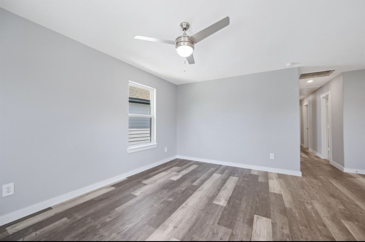 622 Maple Way Houston, TX 77015 - Photo 3 of 19 wooden floor in an empty room with a window