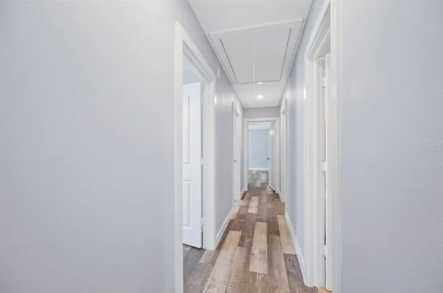 a view of a hallway with a white walls