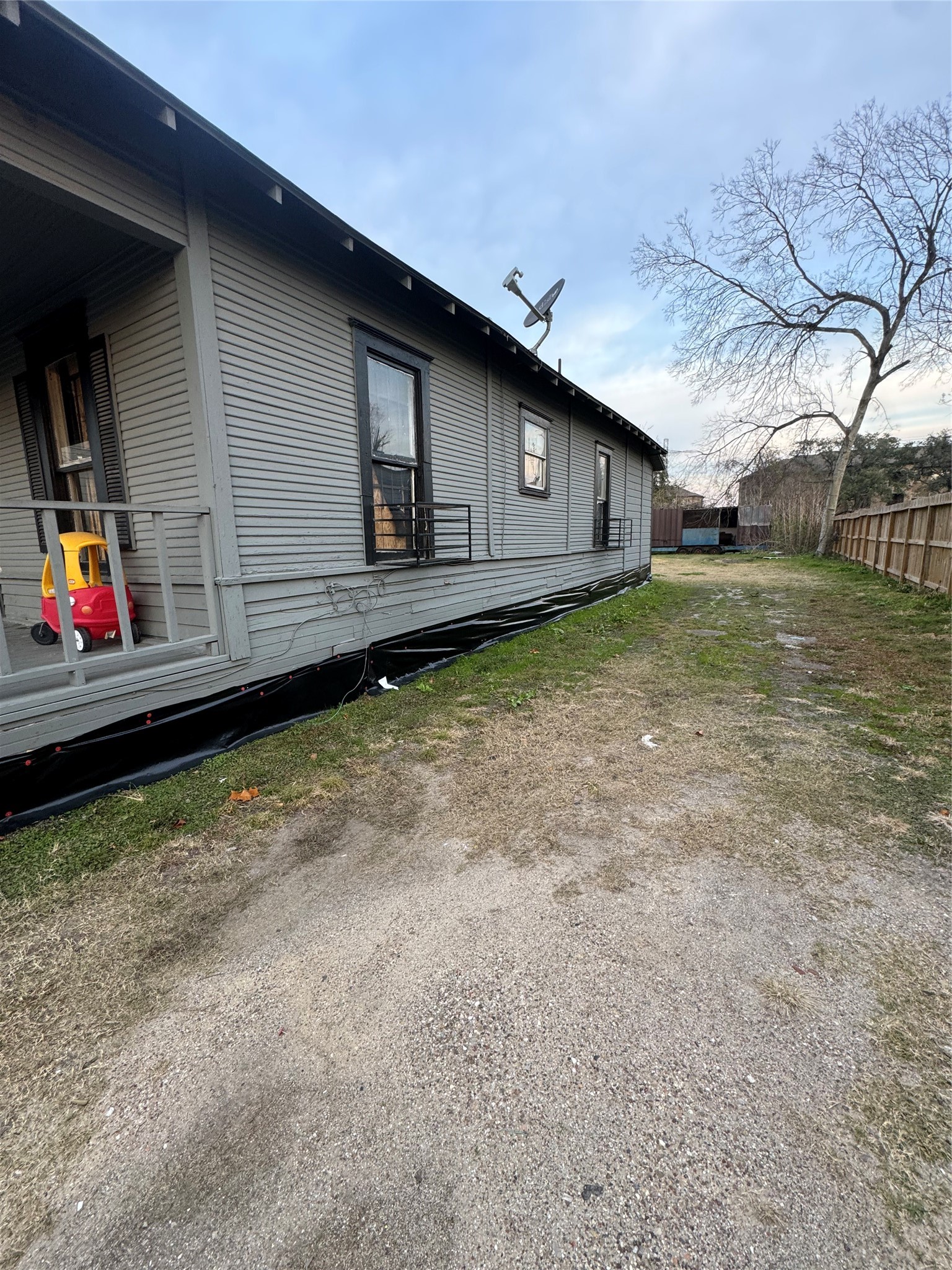 4013 King Street Houston, TX 77026 - Photo 6 of 8 a backyard of a house with wooden fence table and chairs
