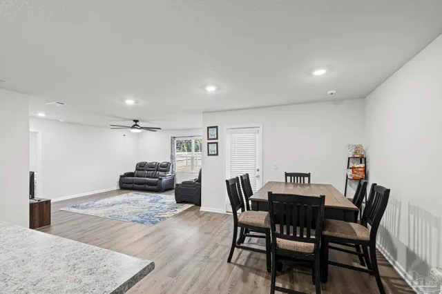 a view of a dining room with furniture