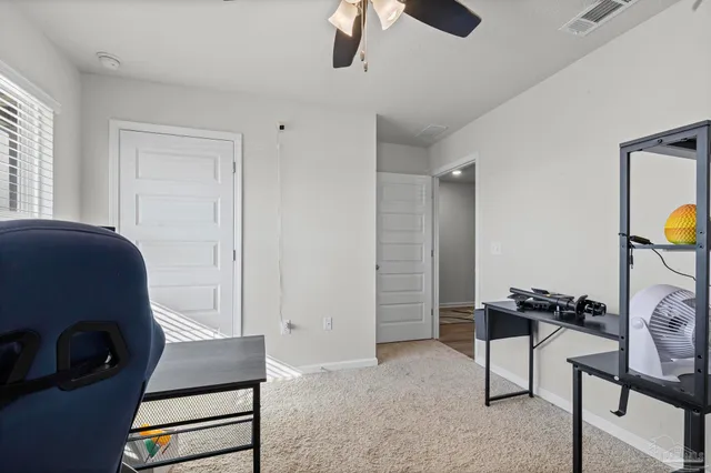a bedroom with a bed and cabinets
