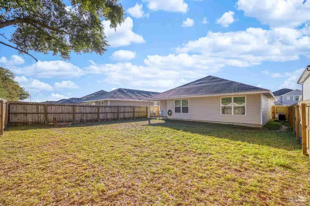 a house with swimming pool in front of it