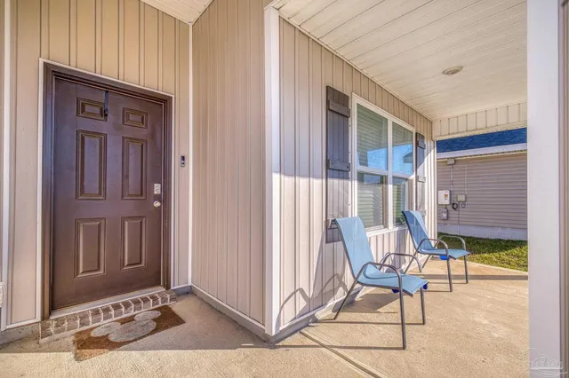 a view of front door with outdoor seating