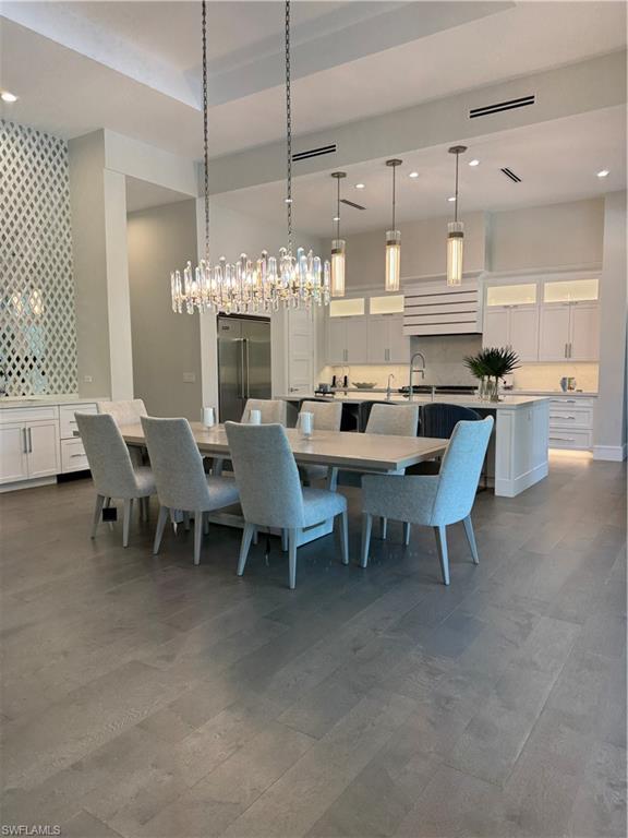 569 Neapolitan Way Naples, FL 34103 - Photo 7 of 50 Dining space featuring visible vents and recessed lighting