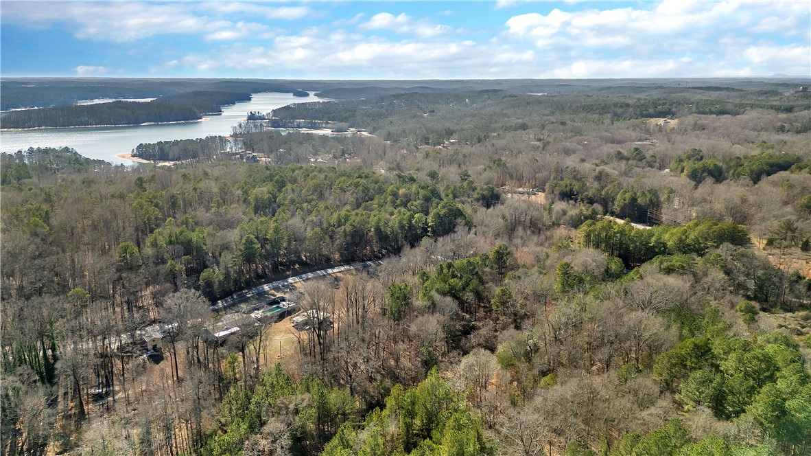 1106 Bay Drive Fair Play, SC 29643 - Photo 5 of 7 This elevated view captures the expansive wooded landscape meeting the serene waters of the lake.