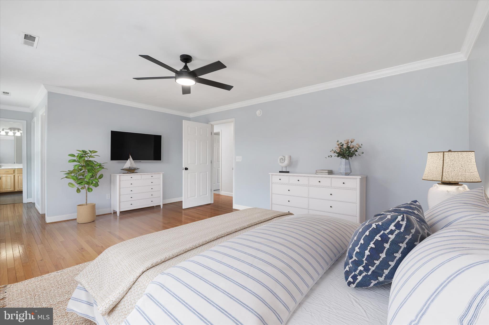 913 Clark Corner Road Centreville, MD 21617 - Photo 27 of 66 a bedroom with a large bed and a flat screen tv