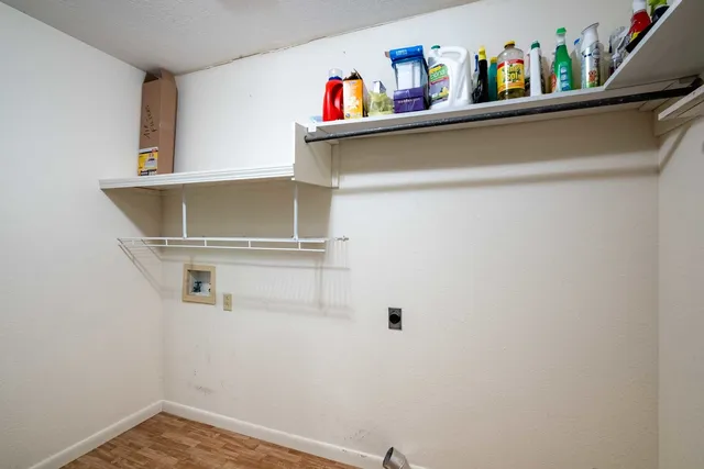 a view of an empty room with a fireplace