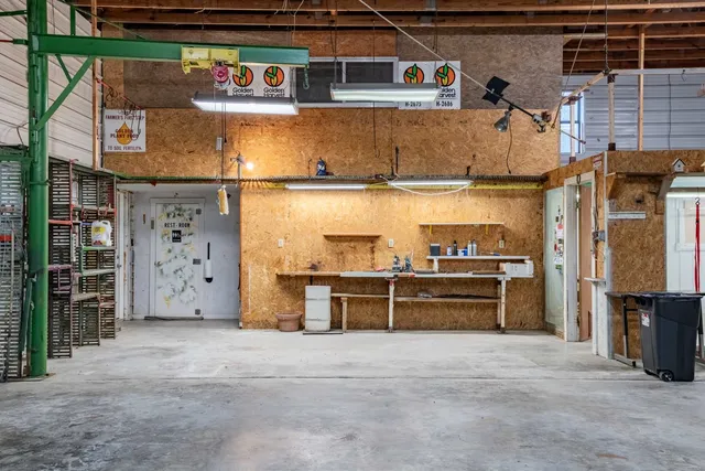 a bathroom with a sink mirror and toilet