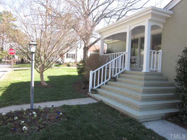 Lovely landscaped beds accent the front porch entry to your new home! You can't beat the location! All within walking distance to Five Points & Fallon Park! Porch