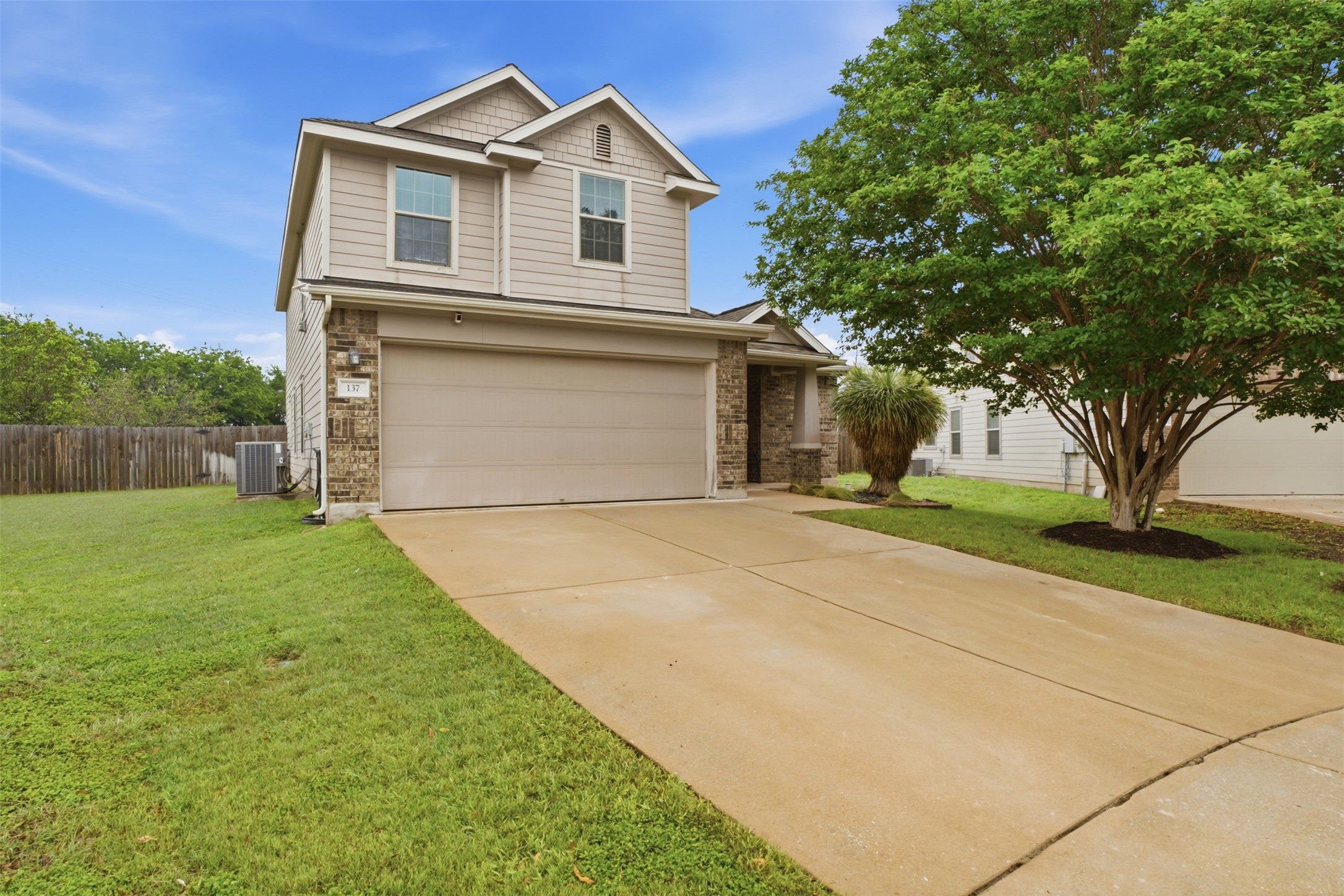 137 Barn Owl Loop Leander, TX 78641 - Photo 2 of 36 a view of a white house with a yard