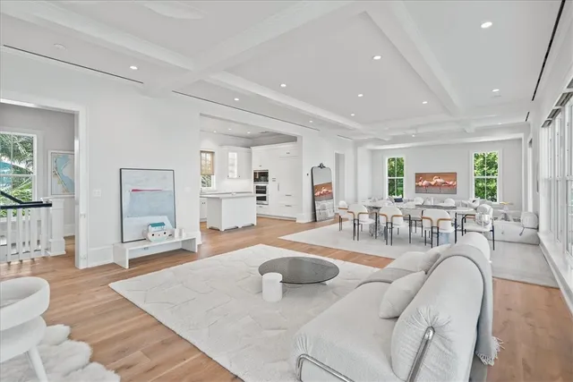 a living room with fireplace furniture and a wooden floor
