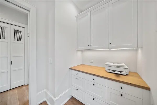 a bathroom with a sink and cabinets