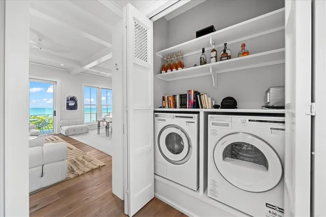 a living room with furniture and a book shelf