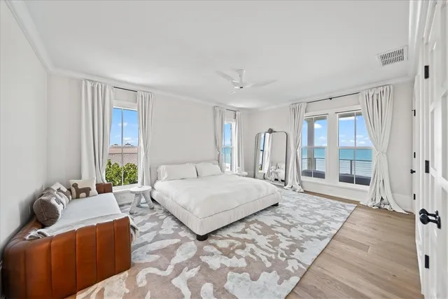 a spacious bedroom with a bed and a couch