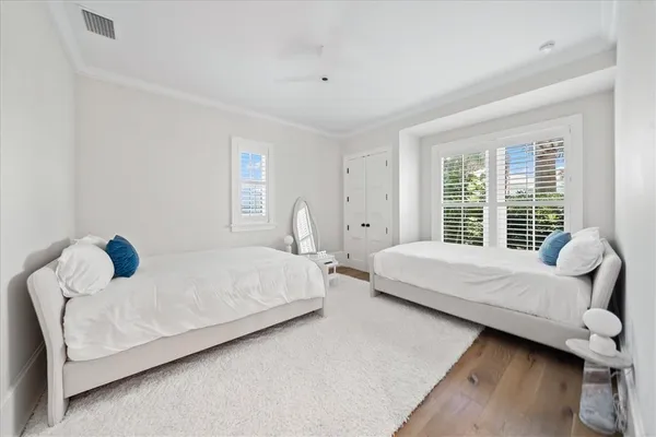 a bedroom with a bed and a couch