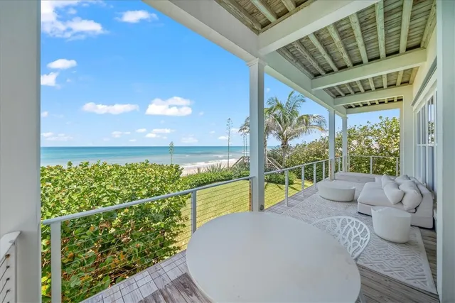 a view of a street with potted plants