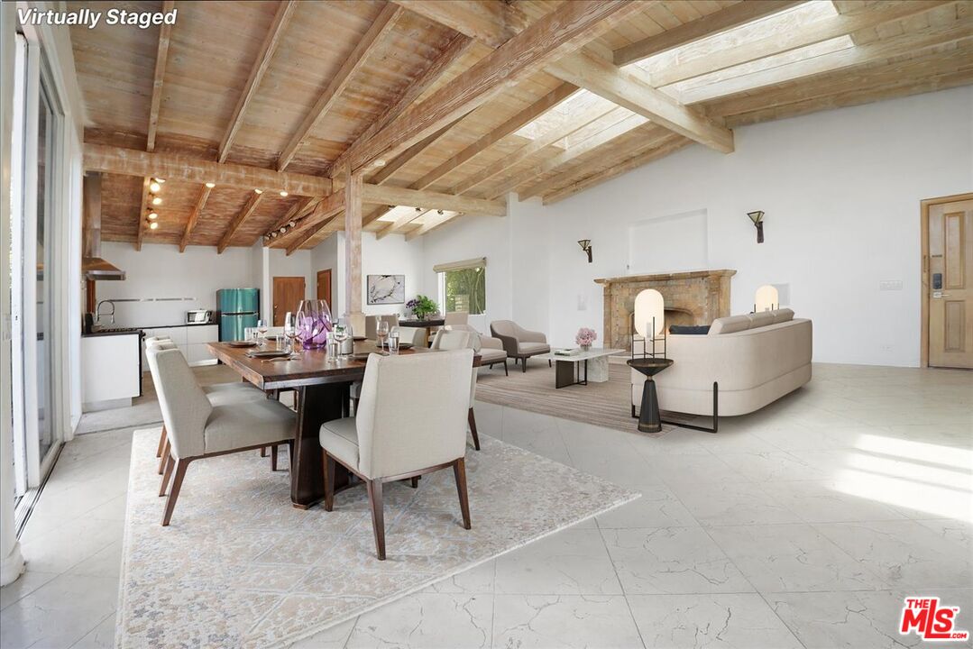 960 North Tigertail Road Los Angeles, CA 90049 - Photo 2 of 21 a living room with furniture and a chandelier