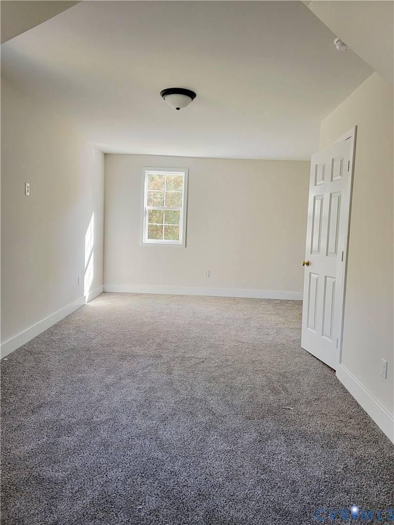 1205 Cox Road Blackstone, VA 23824 - Photo 11 of 29 an empty room with windows