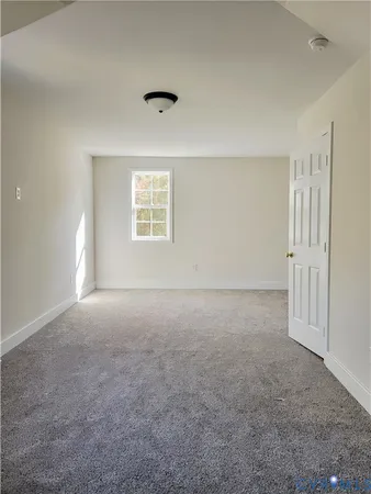 an empty room with a empty space and a window