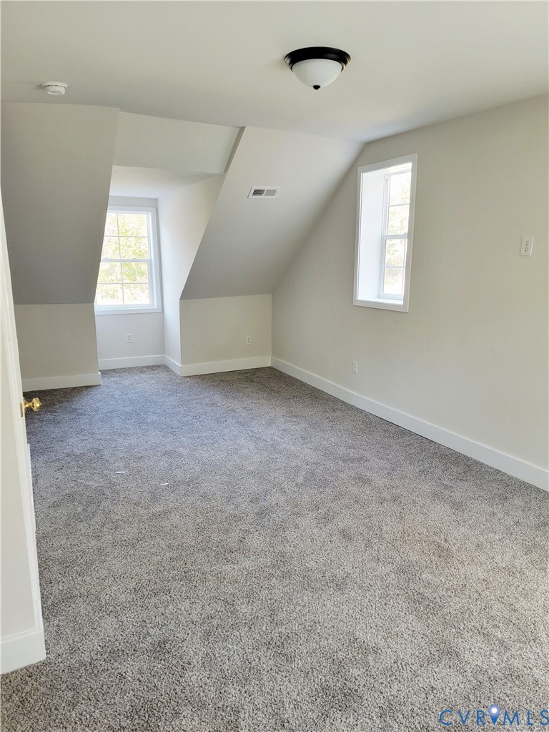 1205 Cox Road Blackstone, VA 23824 - Photo 17 of 29 an empty room with windows