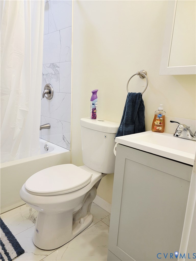 1205 Cox Road Blackstone, VA 23824 - Photo 20 of 29 a bathroom with a toilet and a sink