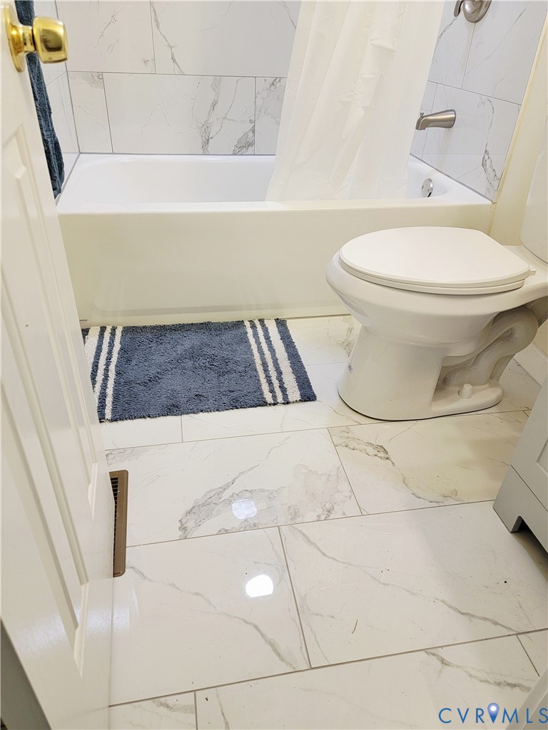 1205 Cox Road Blackstone, VA 23824 - Photo 21 of 29 a bathroom with a toilet and a shower