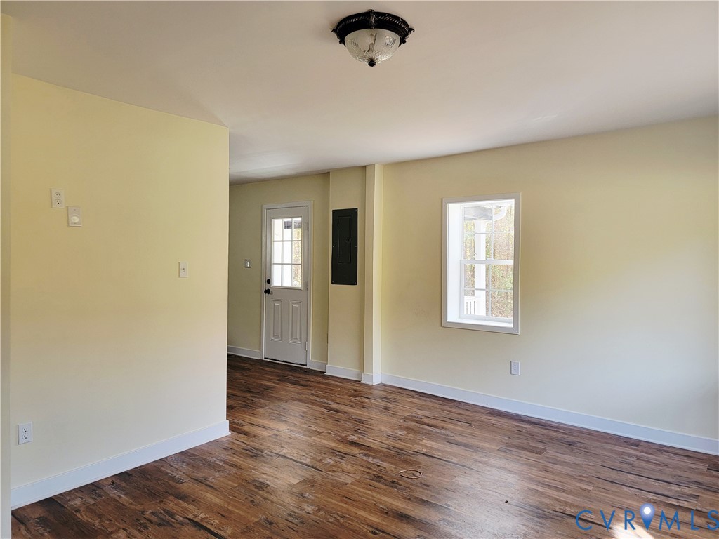 1205 Cox Road Blackstone, VA 23824 - Photo 29 of 29 wooden floor in an empty room with a window