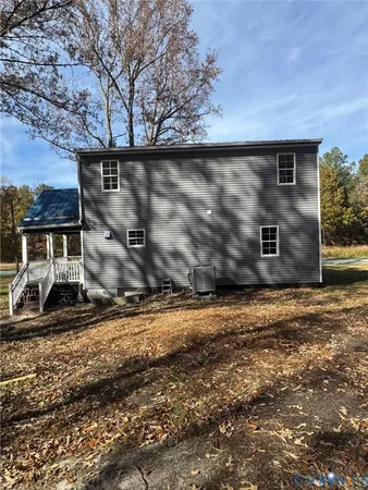 a house with trees in the background