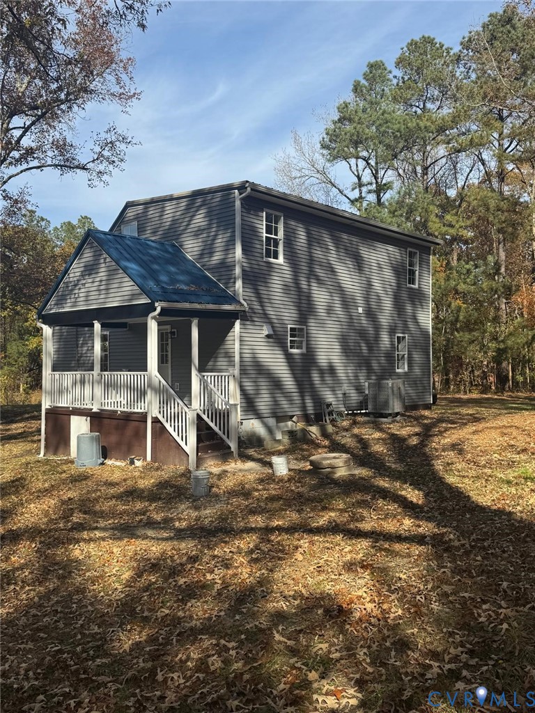 1205 Cox Road Blackstone, VA 23824 - Photo 4 of 29 a house with trees in the background