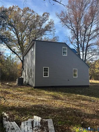 a room with water heater and a wooden door