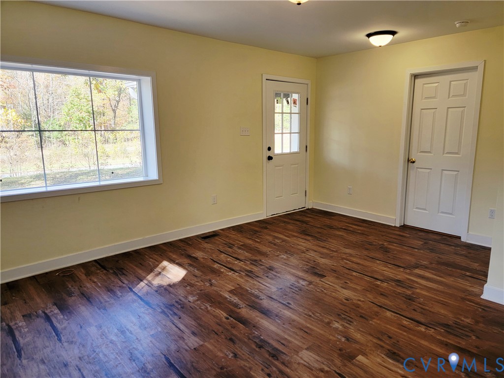 1205 Cox Road Blackstone, VA 23824 - Photo 9 of 29 a view of empty room with wooden floor and fan