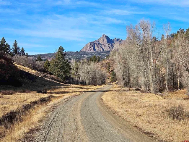 a view of an ocean and a mountain