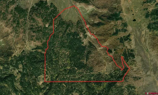 a view of mountain with green field